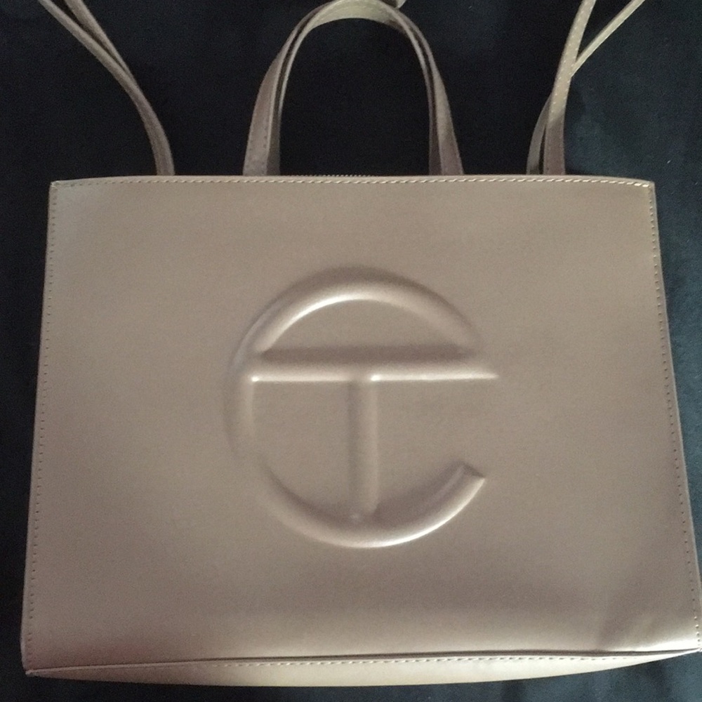 This is a telfar medium cream it is a medium size